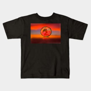 Glass globe on sunset background Kids T-Shirt